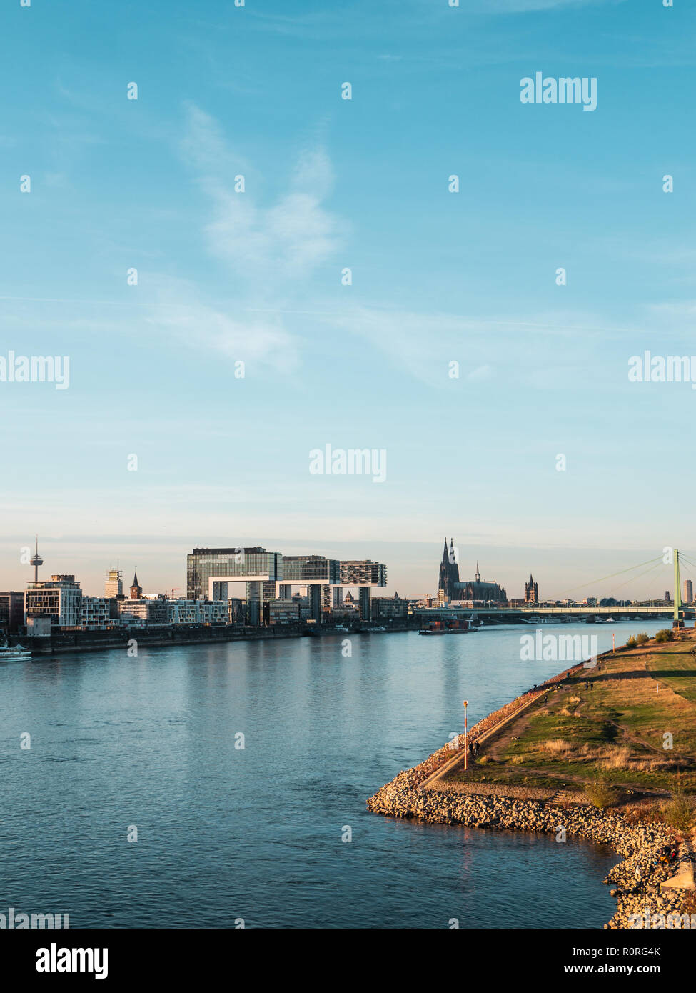 Autumn in Cologne: Cityscape of Cologne, Germany with Cathedral and other landmarks - Poller Wiesen in foreground Stock Photo