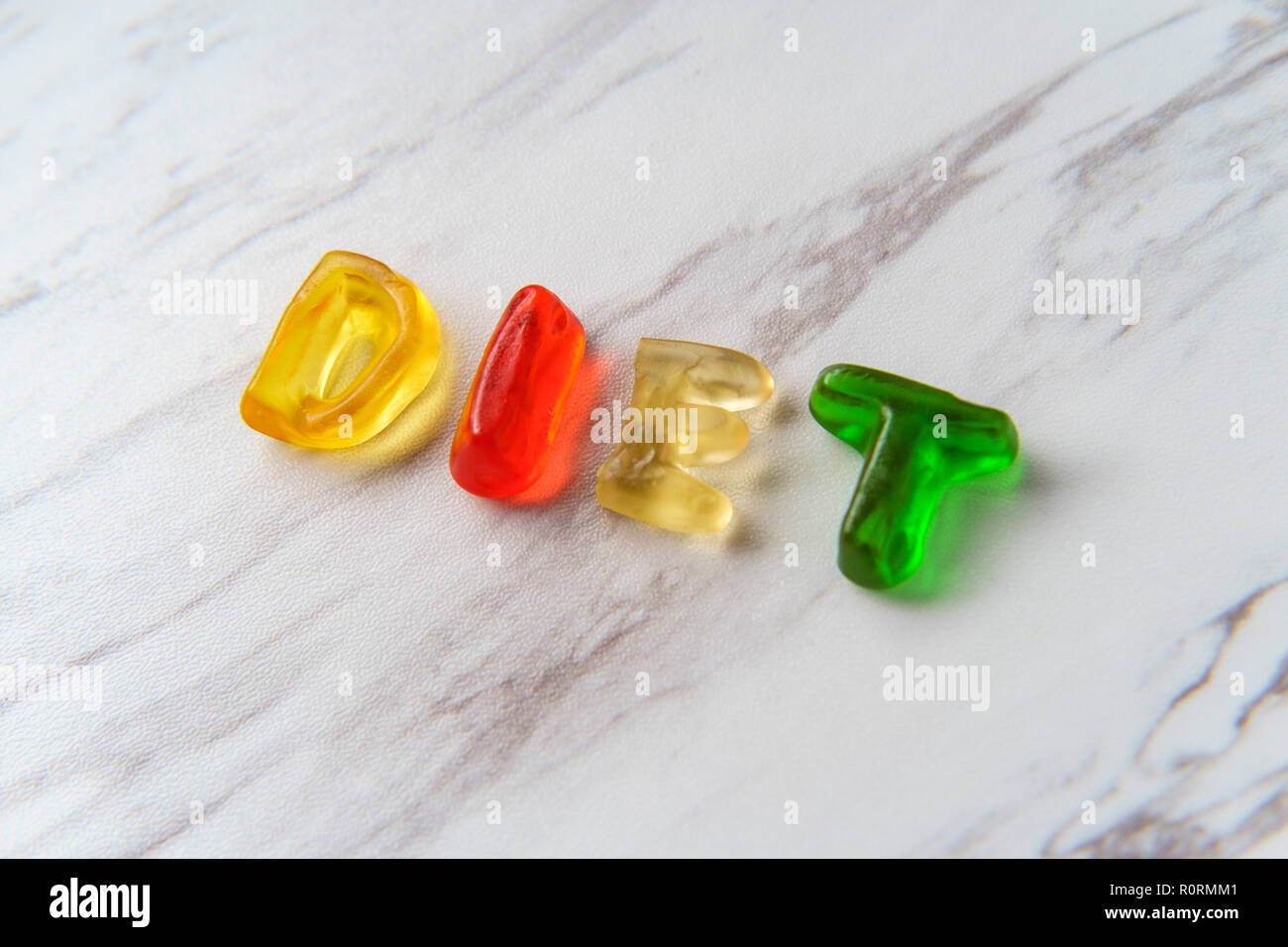 Assorted colorful gummy candy letters spell the word Diet Stock Photo