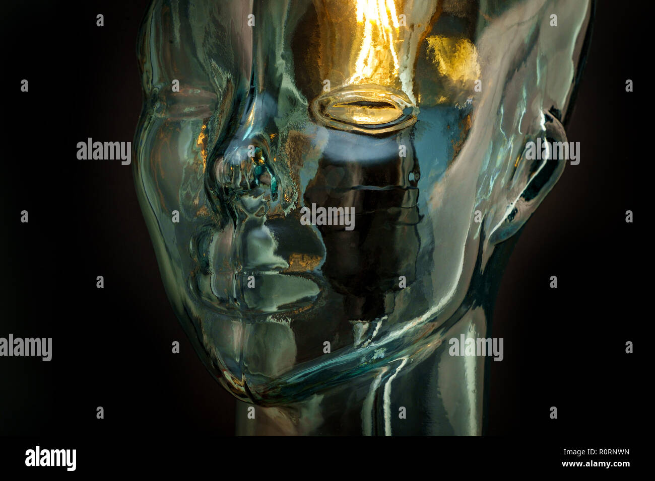 Bright lightbulb inside glass head for creative thoughts and ideas concept Stock Photo