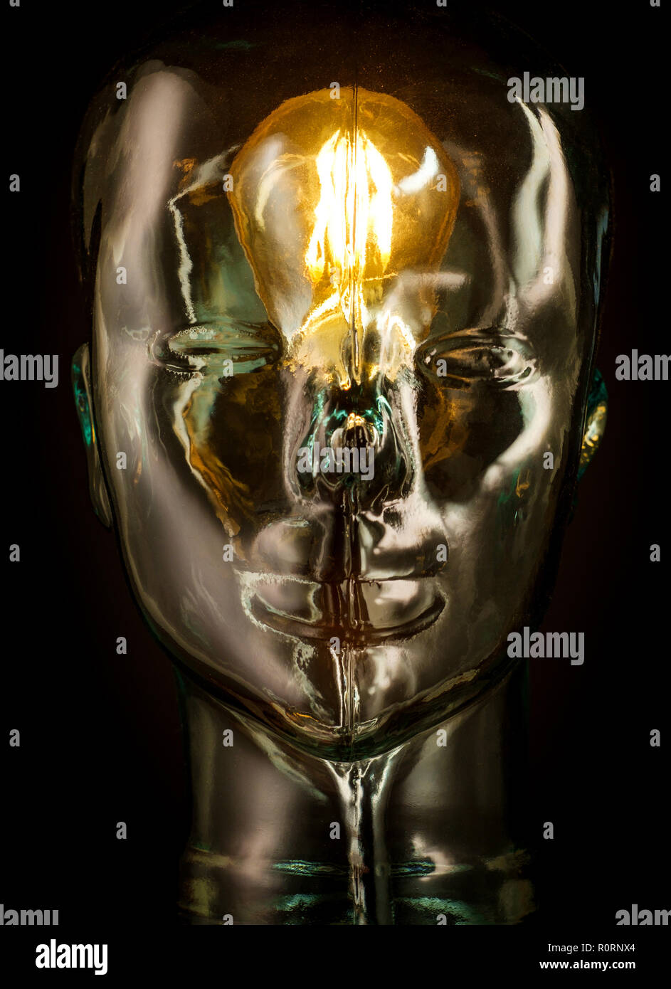 Bright lightbulb inside glass head for creative thoughts and ideas concept Stock Photo