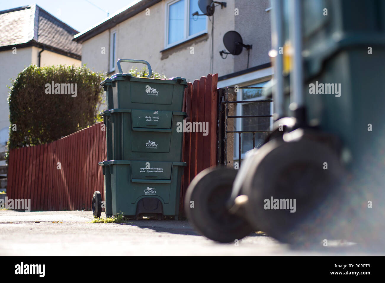General view of recycling bins on a residential street in Mochdre, Wales, as Conwy council