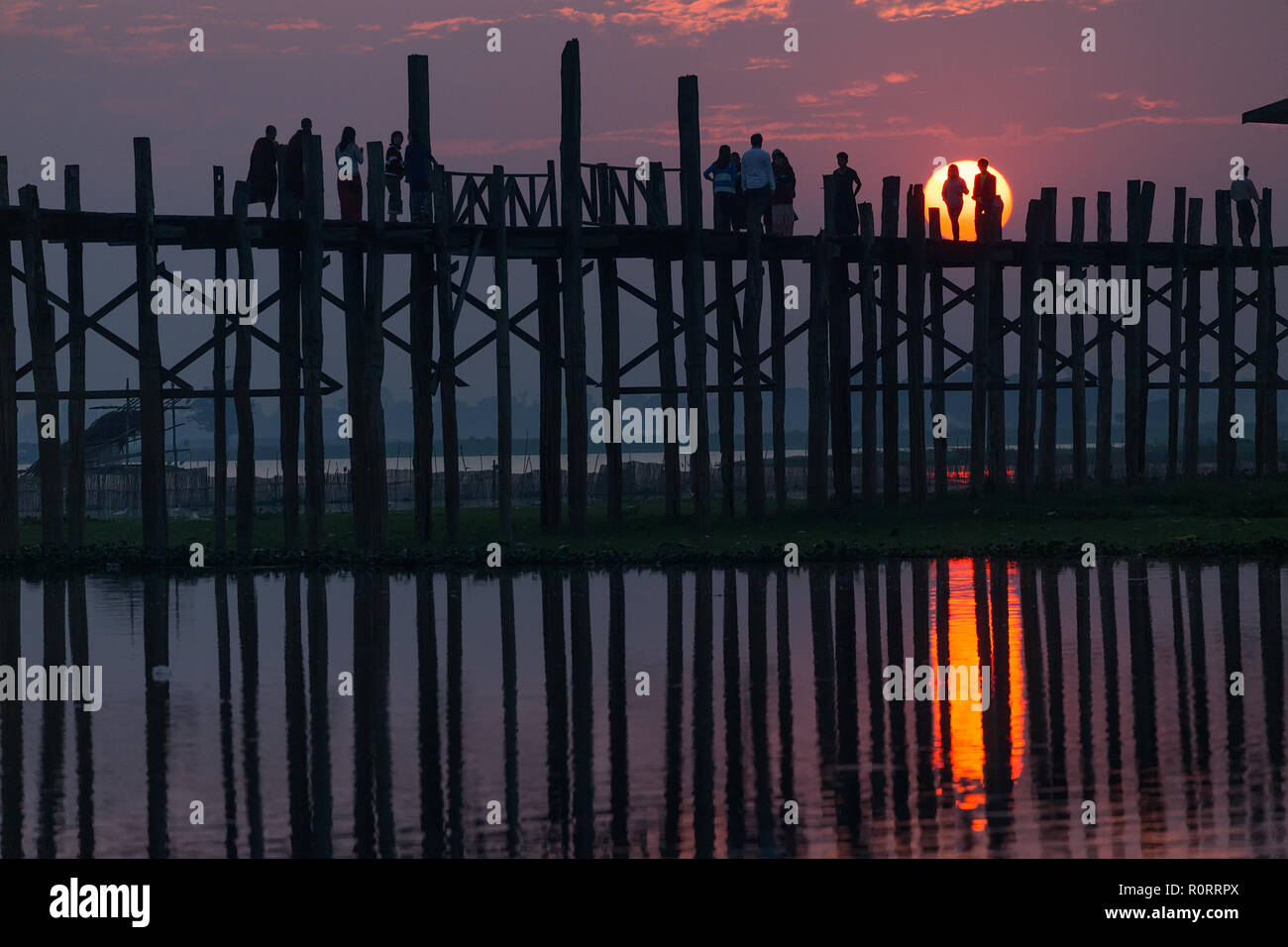 U bein wooden teck bridge with sunset behind the structure, Amarapura ...