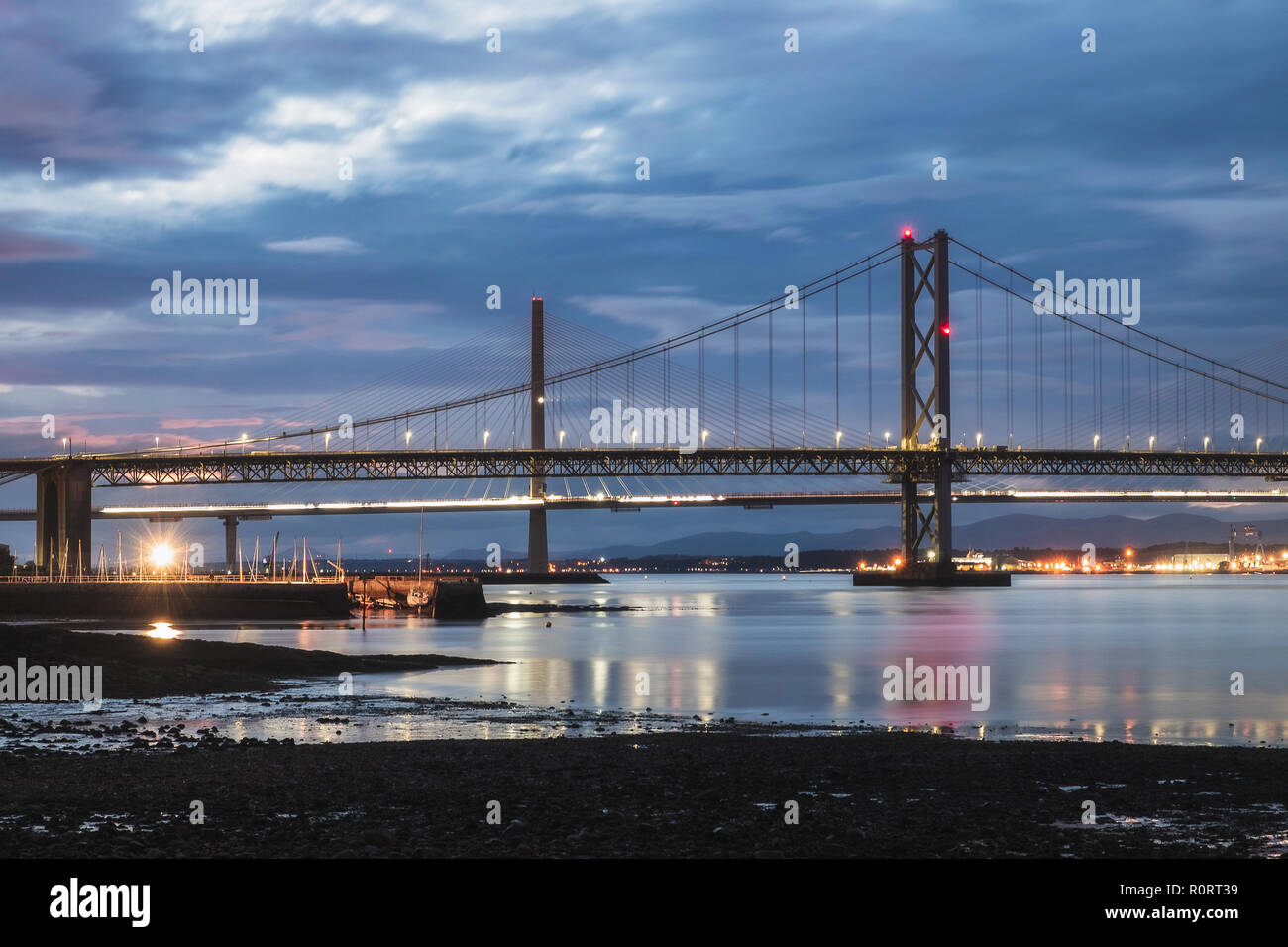 Night view on two bridges, Forth Road Bridge and Queensferry Crossing. Scotland, United Kingdom Stock Photo