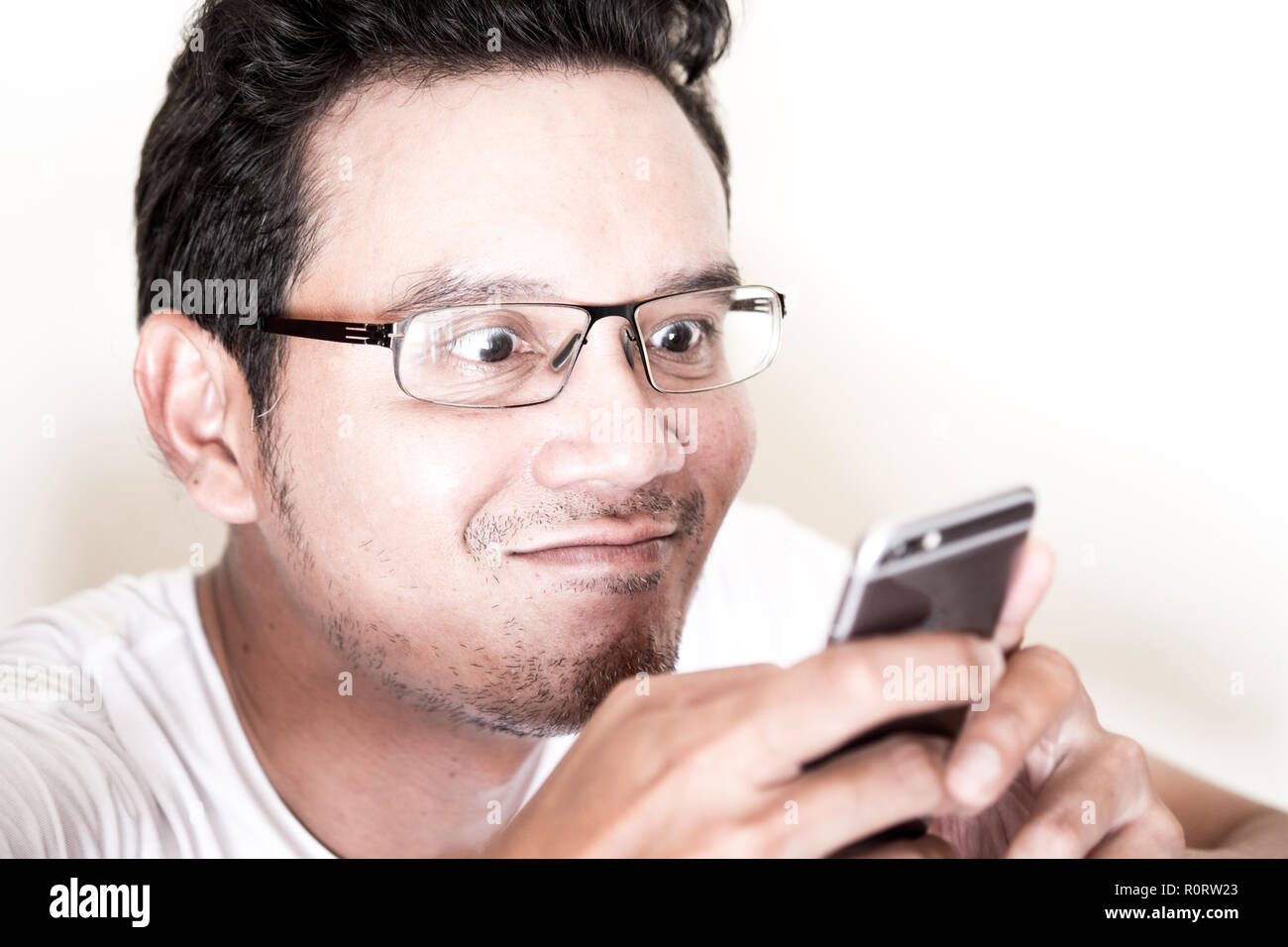 Handsome Asian Man With Light Beard And Curly Hair Wearing