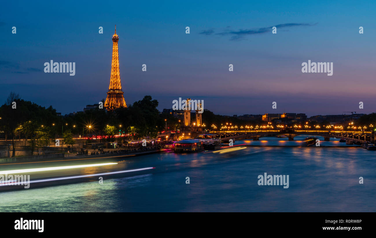 The Eiffel Tower from across the River Seine at night in Paris, France ...