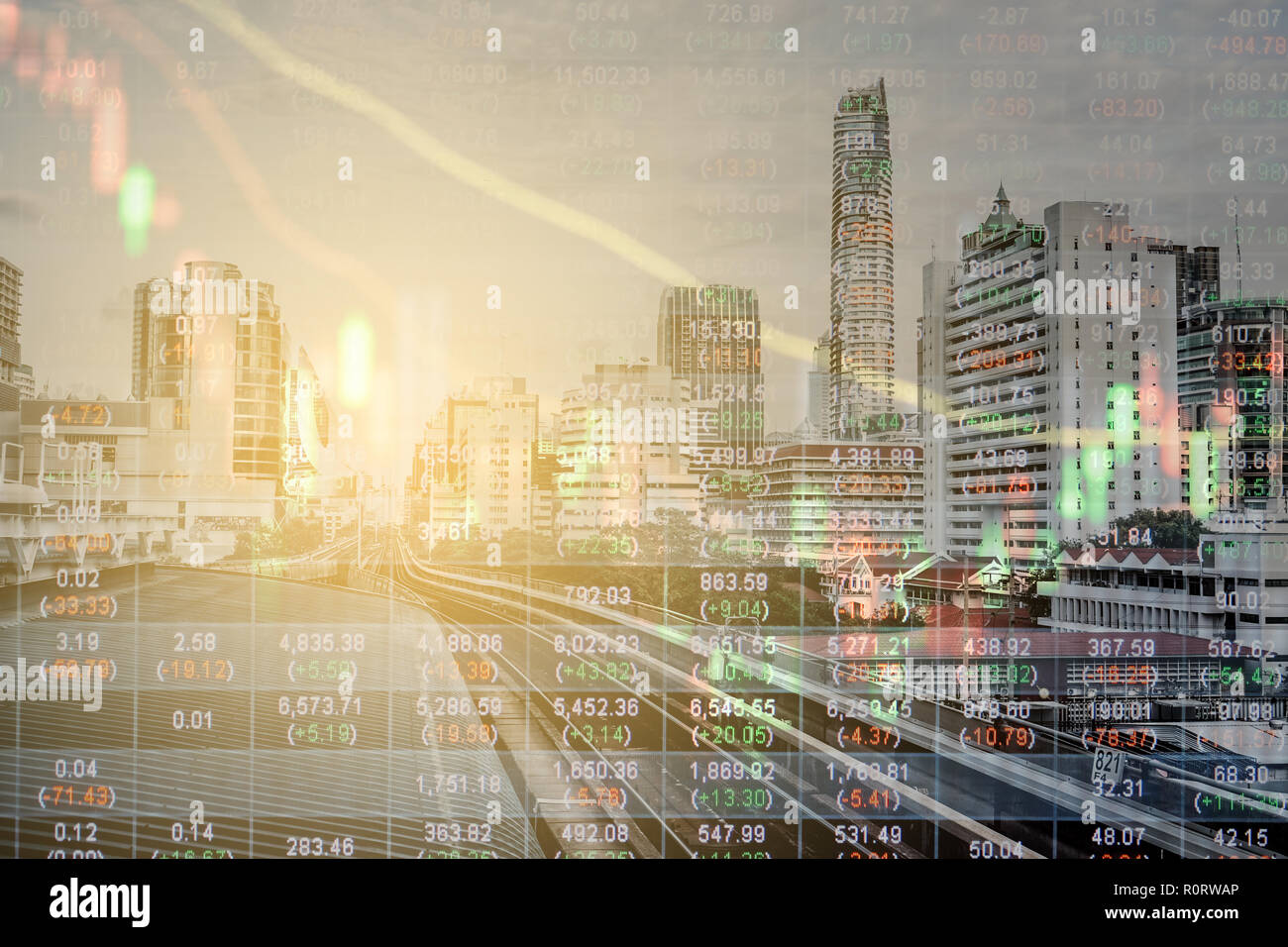 Multiple exposure of urban city, stock market numbers and decline graph. Stock Photo