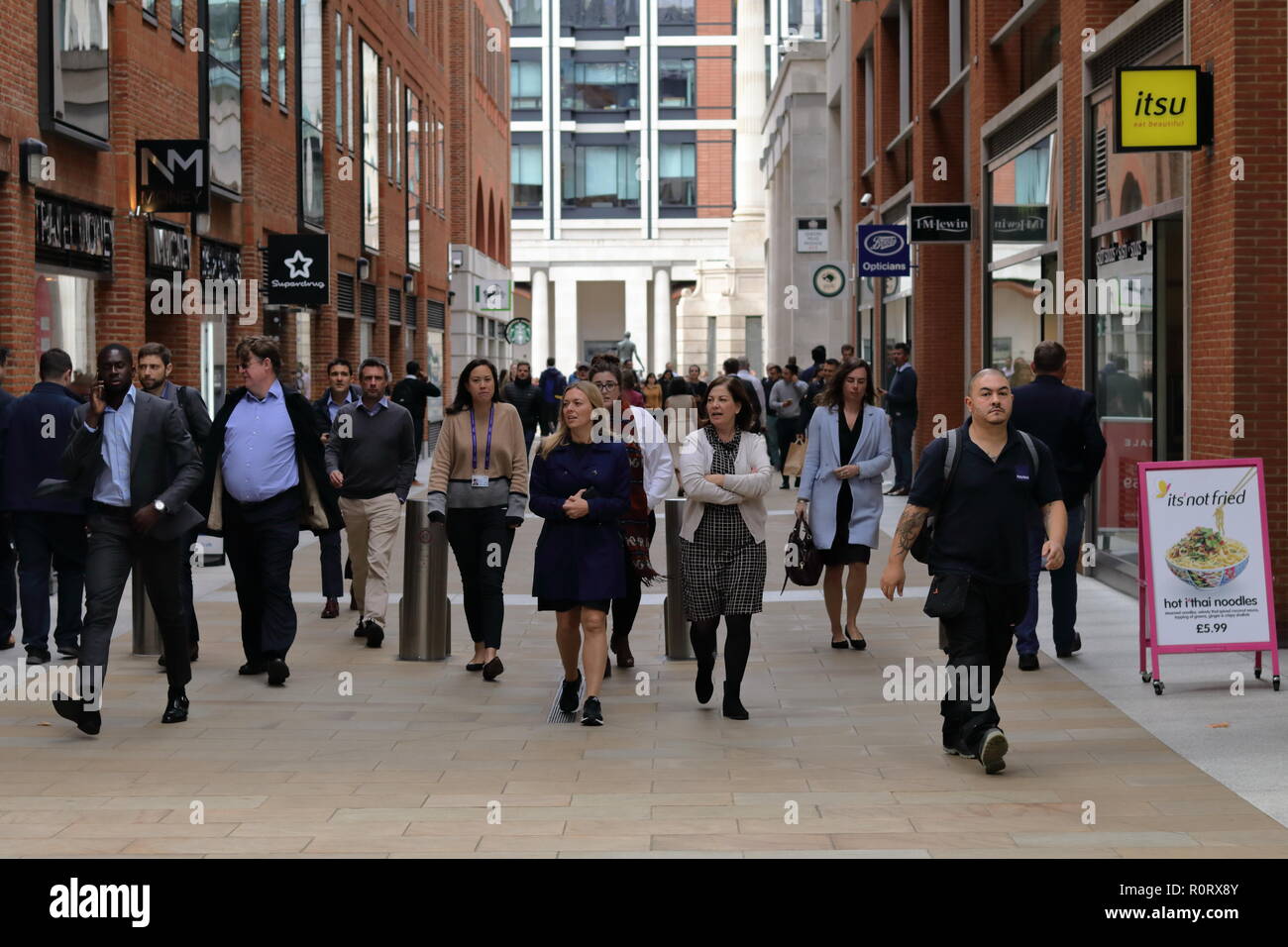 Lunch time in London, busy people rushing for lunch and moving in different directions. London energy Stock Photo