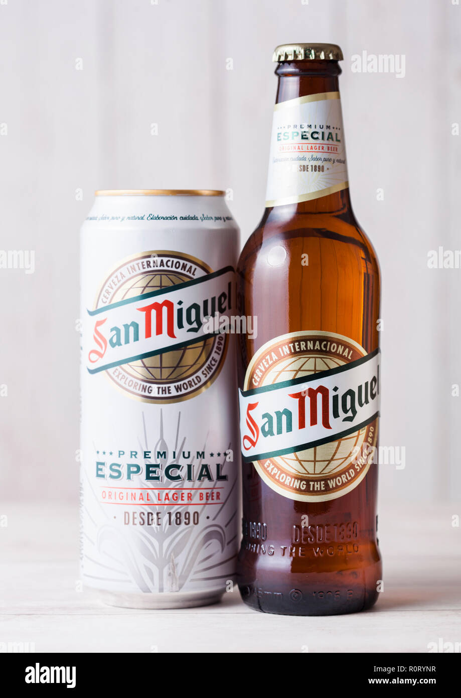 lager beer LONDON, UK 2018: wooden leading San Bottle San background. of - The brand is 27, and Miguel brand Stock can on Miguel - Photo Alamy APRIL aluminium beer of the