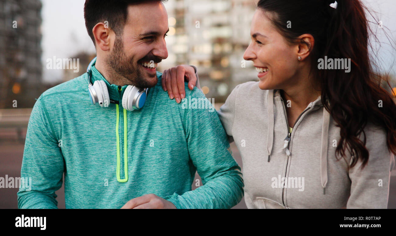 Happy young sporty couple sharing romantic moments Stock Photo - Alamy