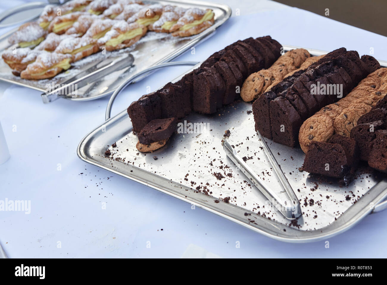 breakfast buffet at hotel.Food tray with chokolate cake and cookies. Stock Photo