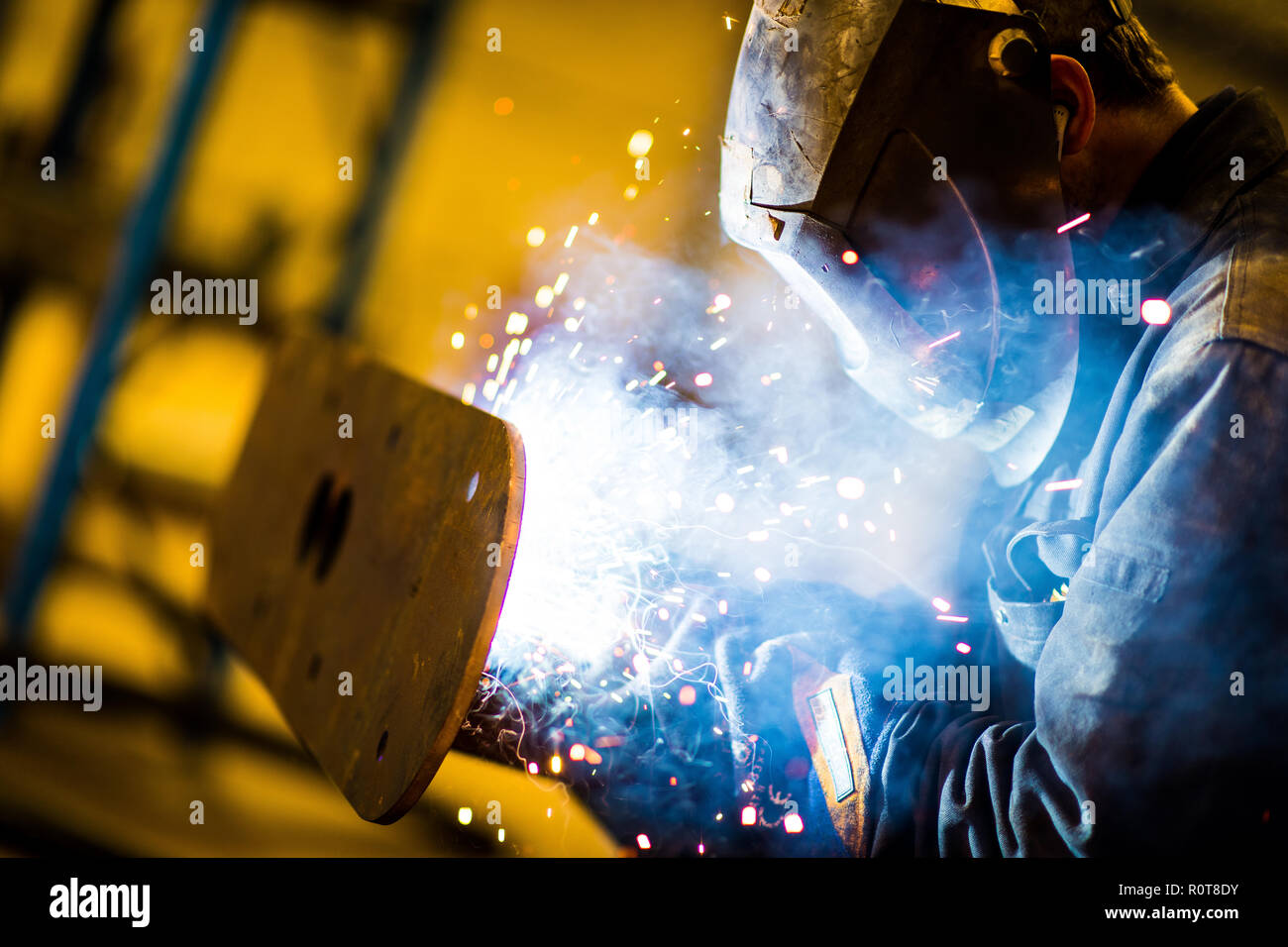 A Mig, Tig welder fabricates some steel products at an engineering