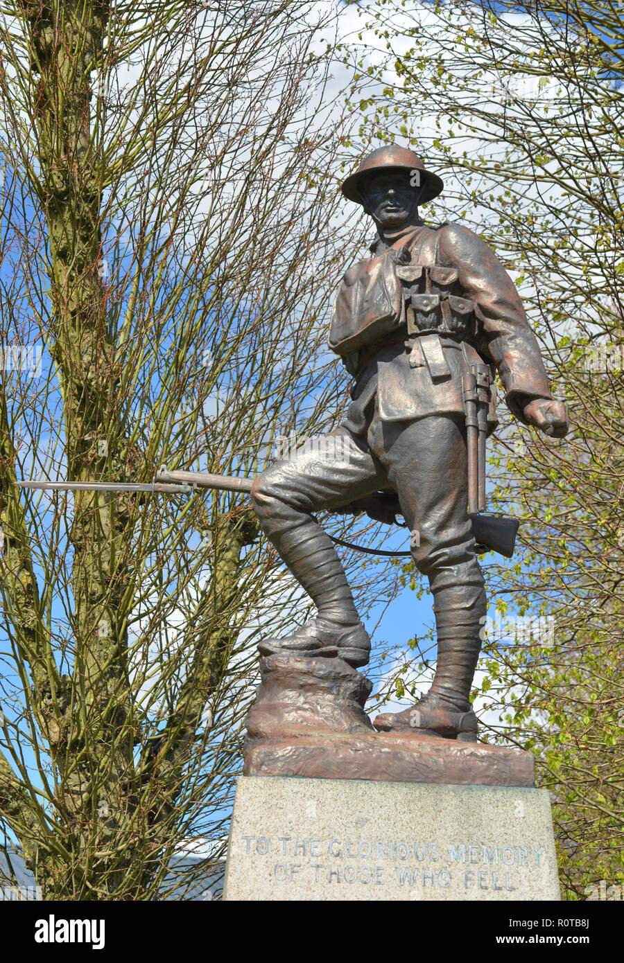 Bronze statue of a British First World War infantryman in full battledress standing above the 41st Division memorial, Flers, France Stock Photo
