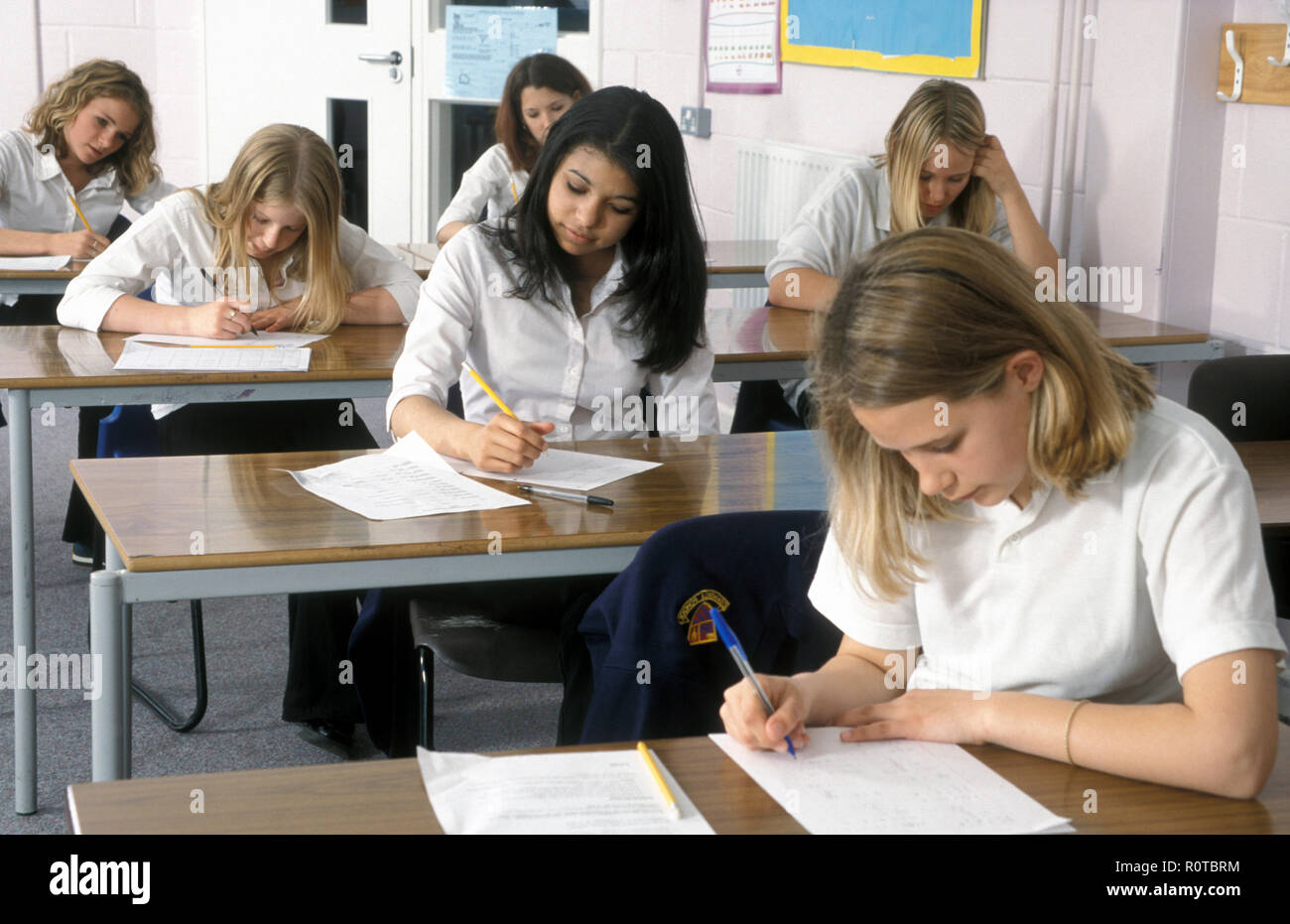 high school girls engaged in exam or test Stock Photo