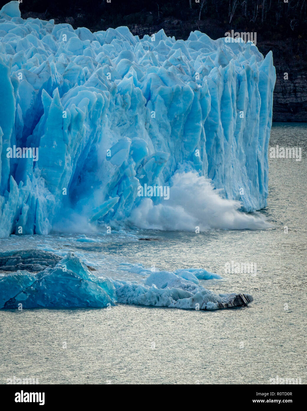 ice breaking and splashing at water on glaciar Perito Moreno, El Calafate, Argentina, Patagonia Stock Photo