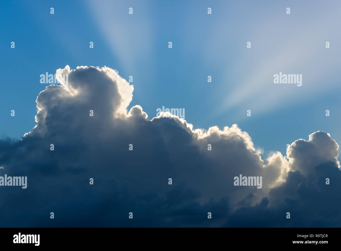 Dramatic cloudscape with sun rays Stock Photo - Alamy