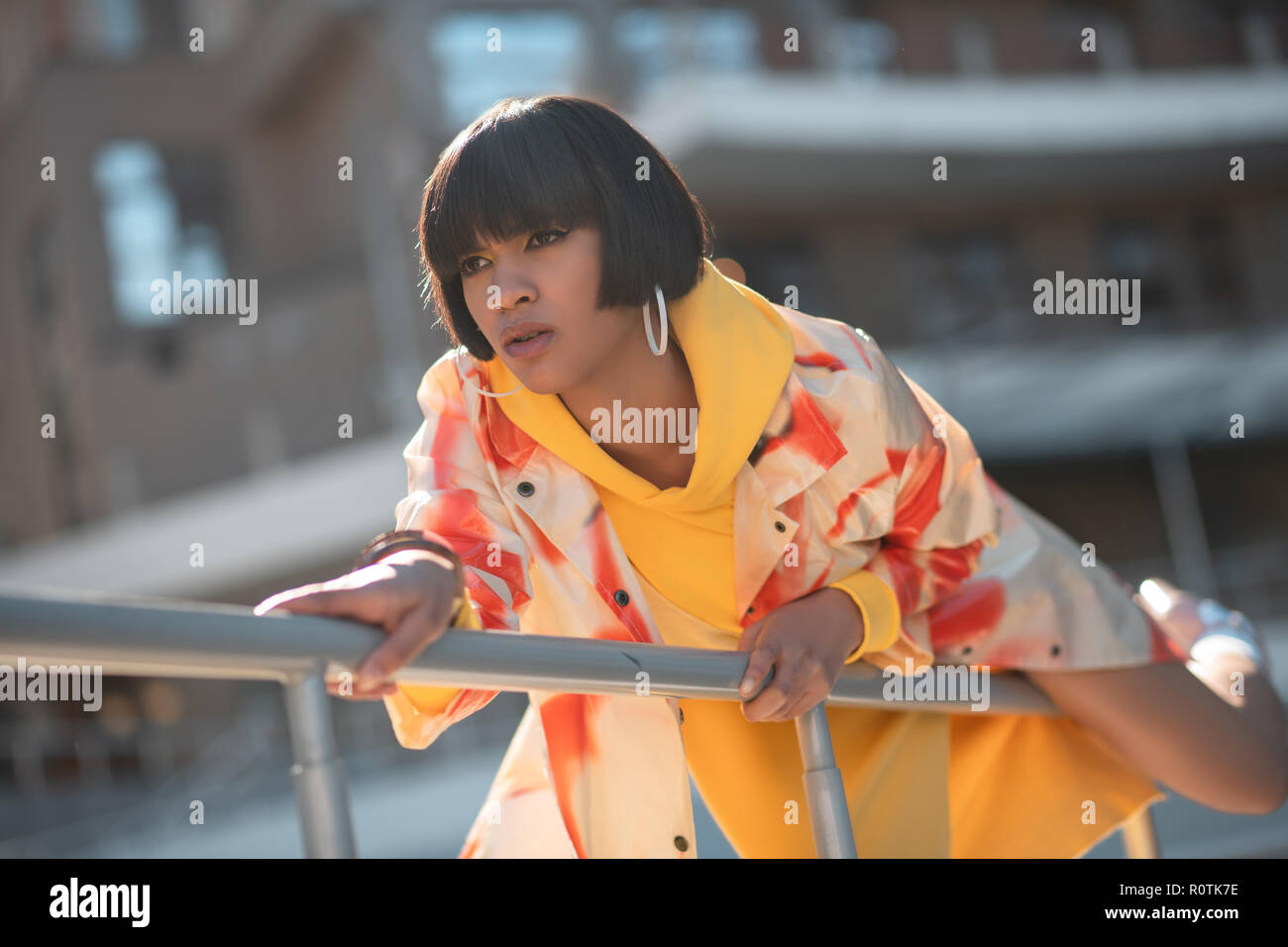 Newfangled contemptuous chick awkwardly posing during photoshoot Stock Photo