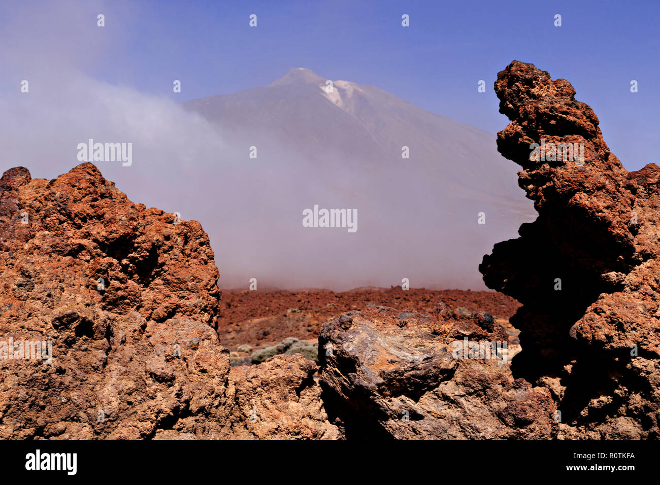 Mount Teide volcano in clouds with lava field on Tenerife in the Canary Islands Stock Photo