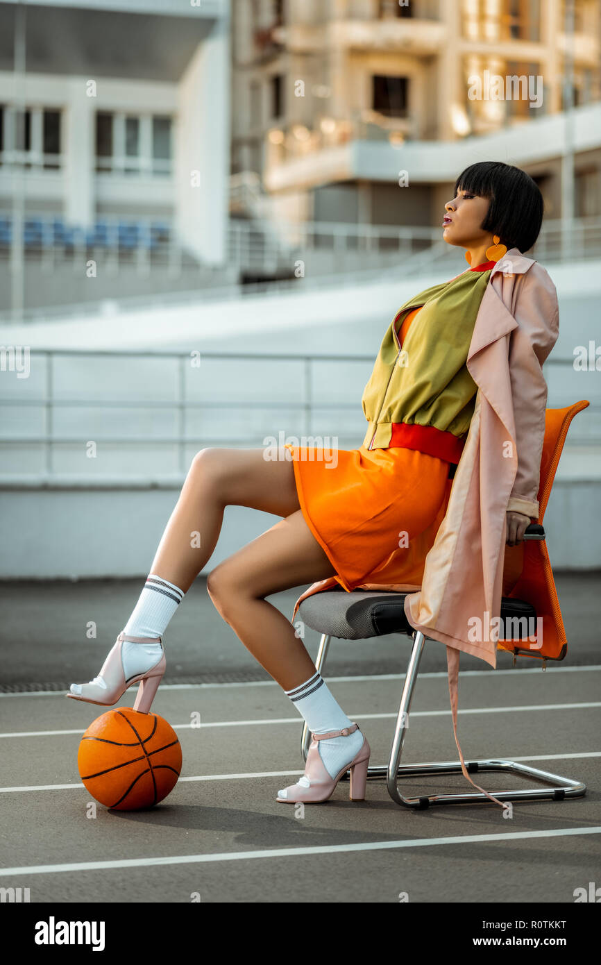 Independent short-haired African American model wearing khaki bomber Stock Photo