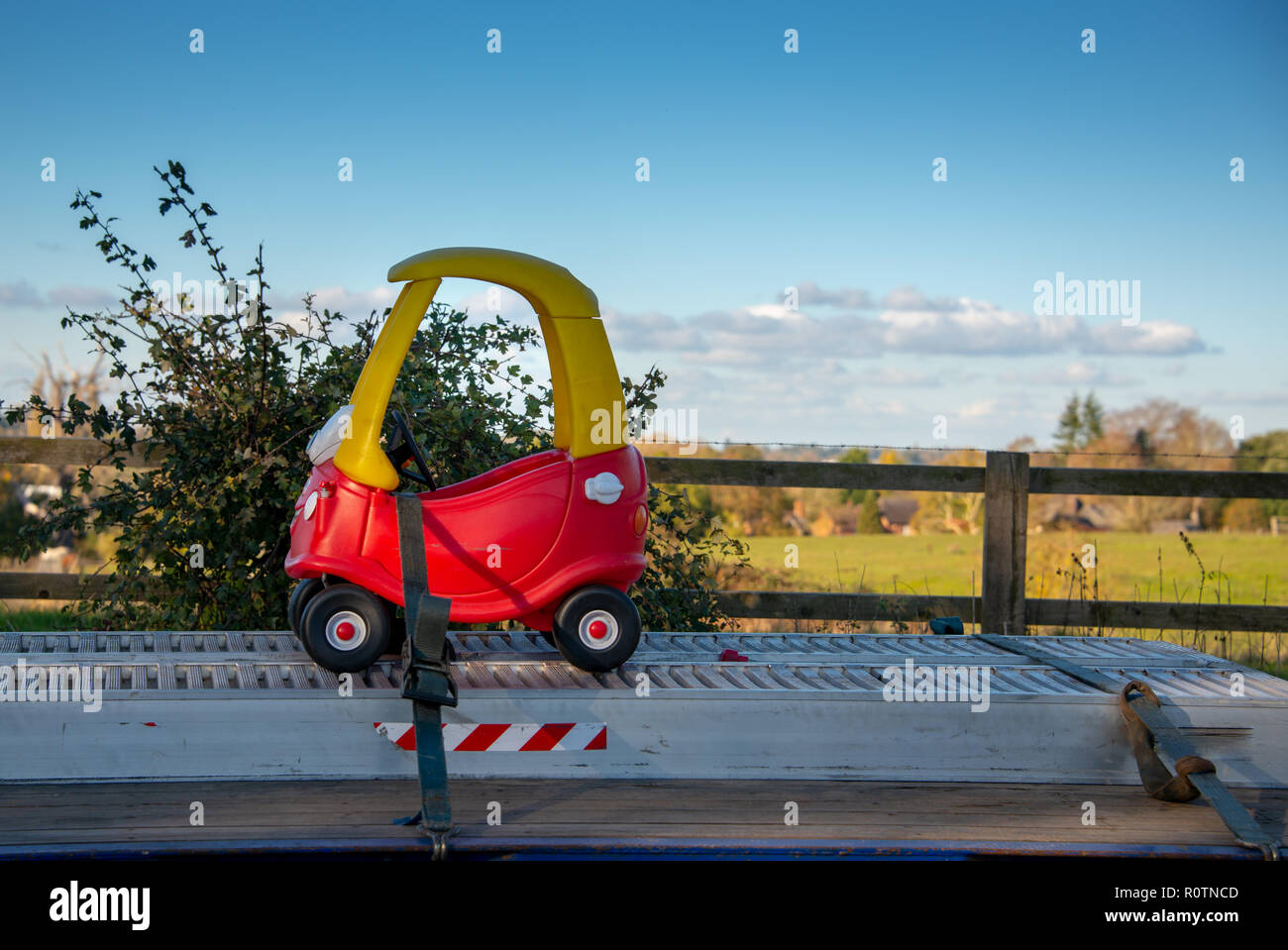 funny picture of small red toy car being delivered on an oversized large truck with English countryside in the background Stock Photo - Alamy funny picture of small red toy car being delivered on an oversized large truck with English countryside in the background Stock Photo - Alamy