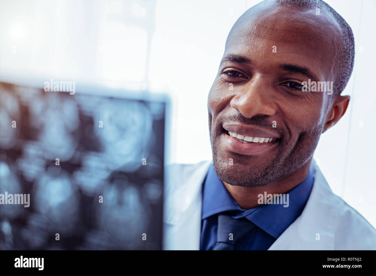 Portrait of a happy smiling male doctor Stock Photo - Alamy