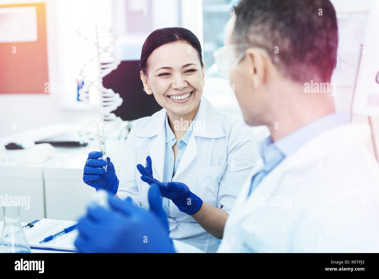 Happy nice smart scientists making new discoveries Stock Photo