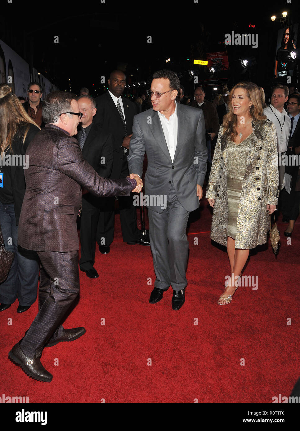 Robin Williams, with John Travolta and Kelly Preston ( checking the belly ! )   - Old Dogs Premiere at the El Capitan Theatre In Los Angeles.          Stock Photo