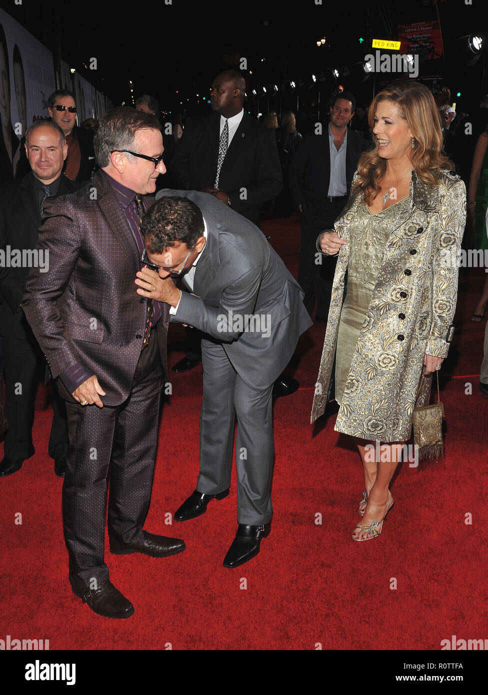 Robin Williams, with John Travolta and Kelly Preston ( checking the belly ! )   - Old Dogs Premiere at the El Capitan Theatre In Los Angeles.          Stock Photo