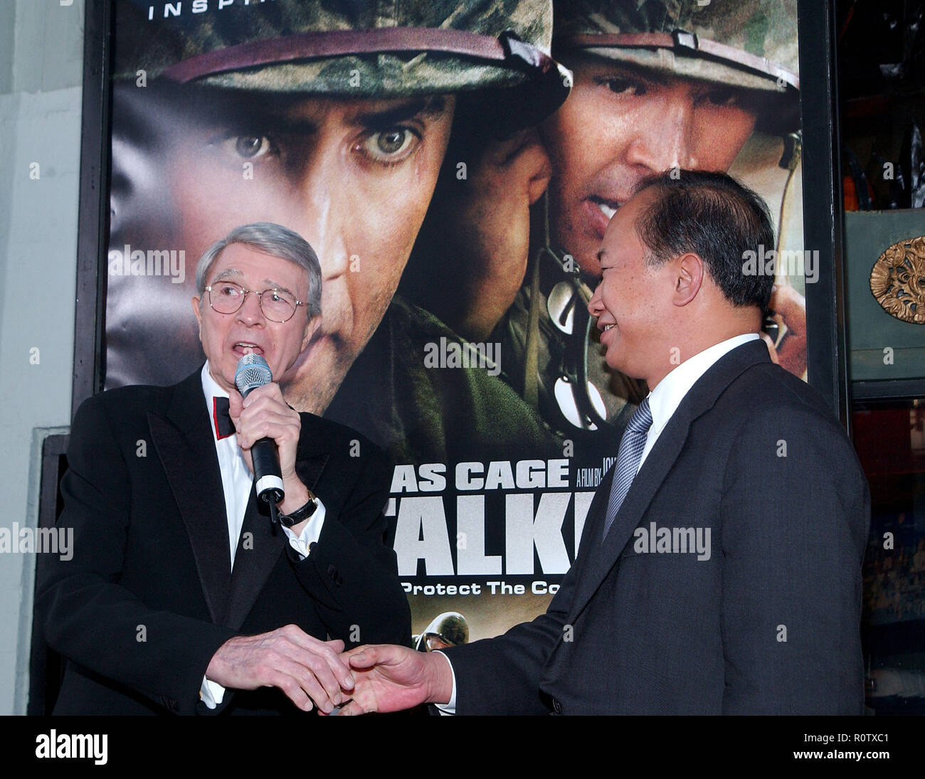 Army Archerd and the director John Woo at the Windtalkers premiere at the Chinese Theatre in Los Angeles. June 11, 2002.          -            Archerd Stock Photo