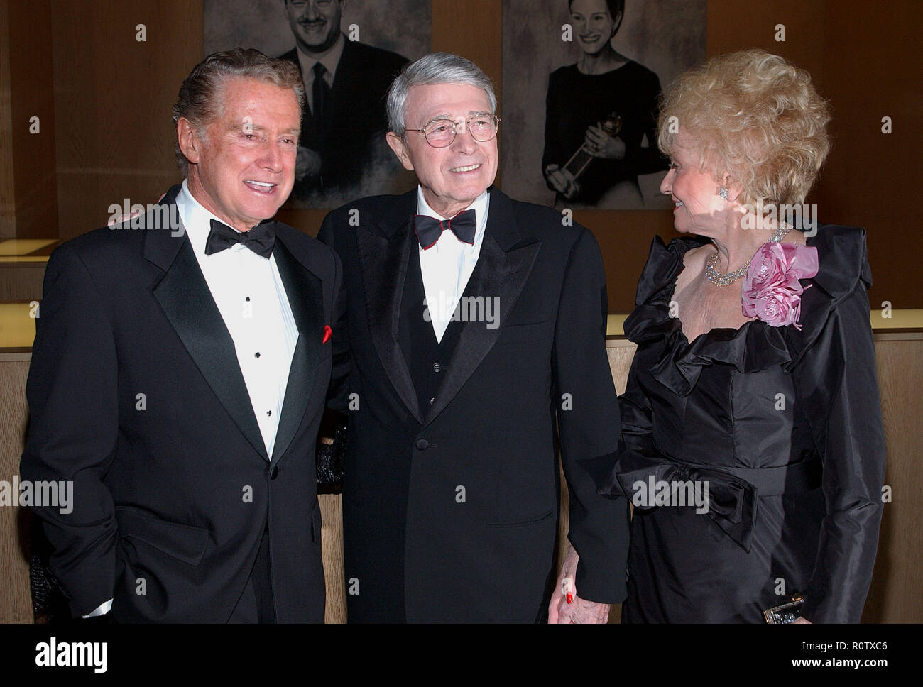 Army Archerd and wife posing with Regis Philbin at the ' Variety Salutes Army Archerd's 50th Anniversary ' at the Beverly Hilton  in Los Angeles. Apri Stock Photo