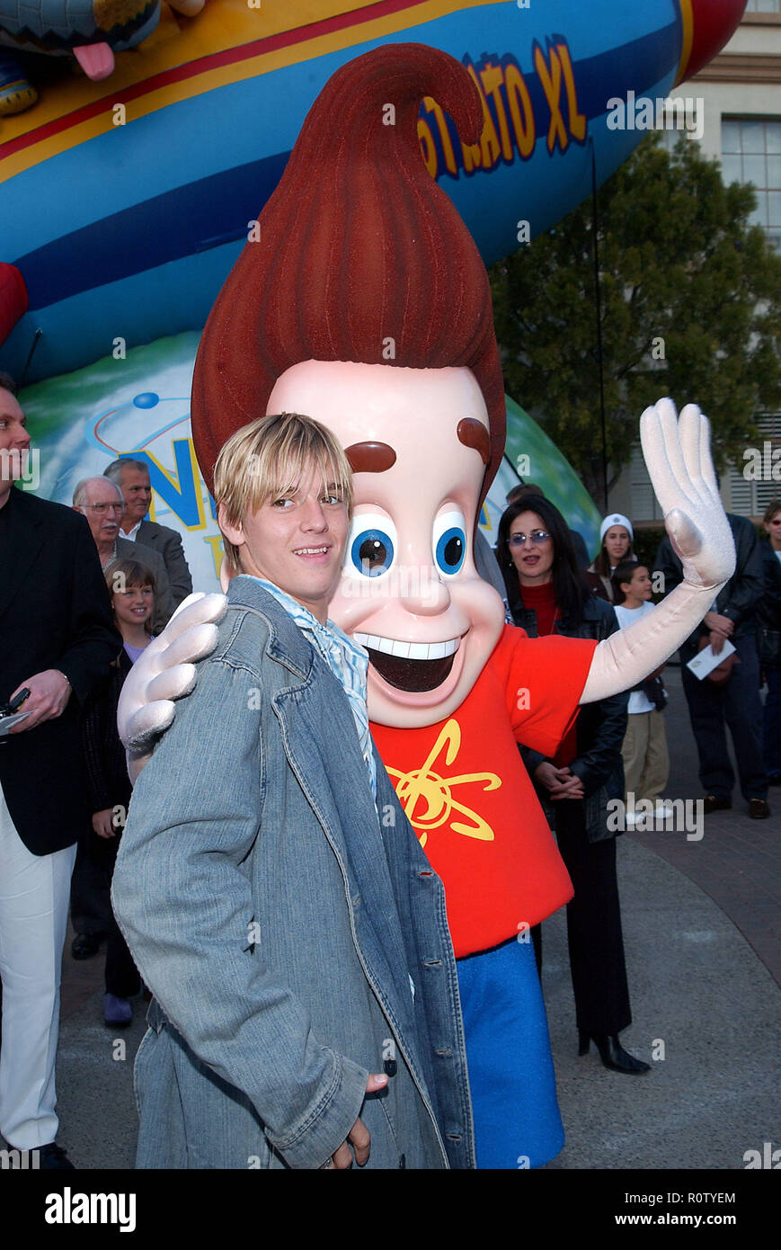 Aaron Carter posing  with Jimmy Neutron at the Jimmy Neutron: Boy Genius premiere on the Paramount lot in Los Angeles. December 9, 2001.           -   Stock Photo