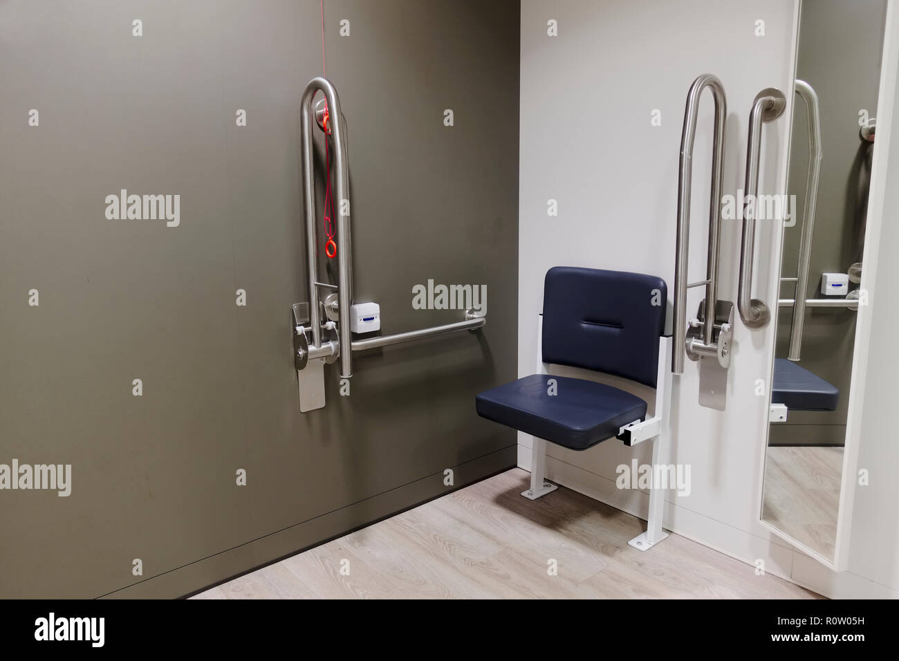 Disabled changing room with grab rails and seat doc m pack in shop