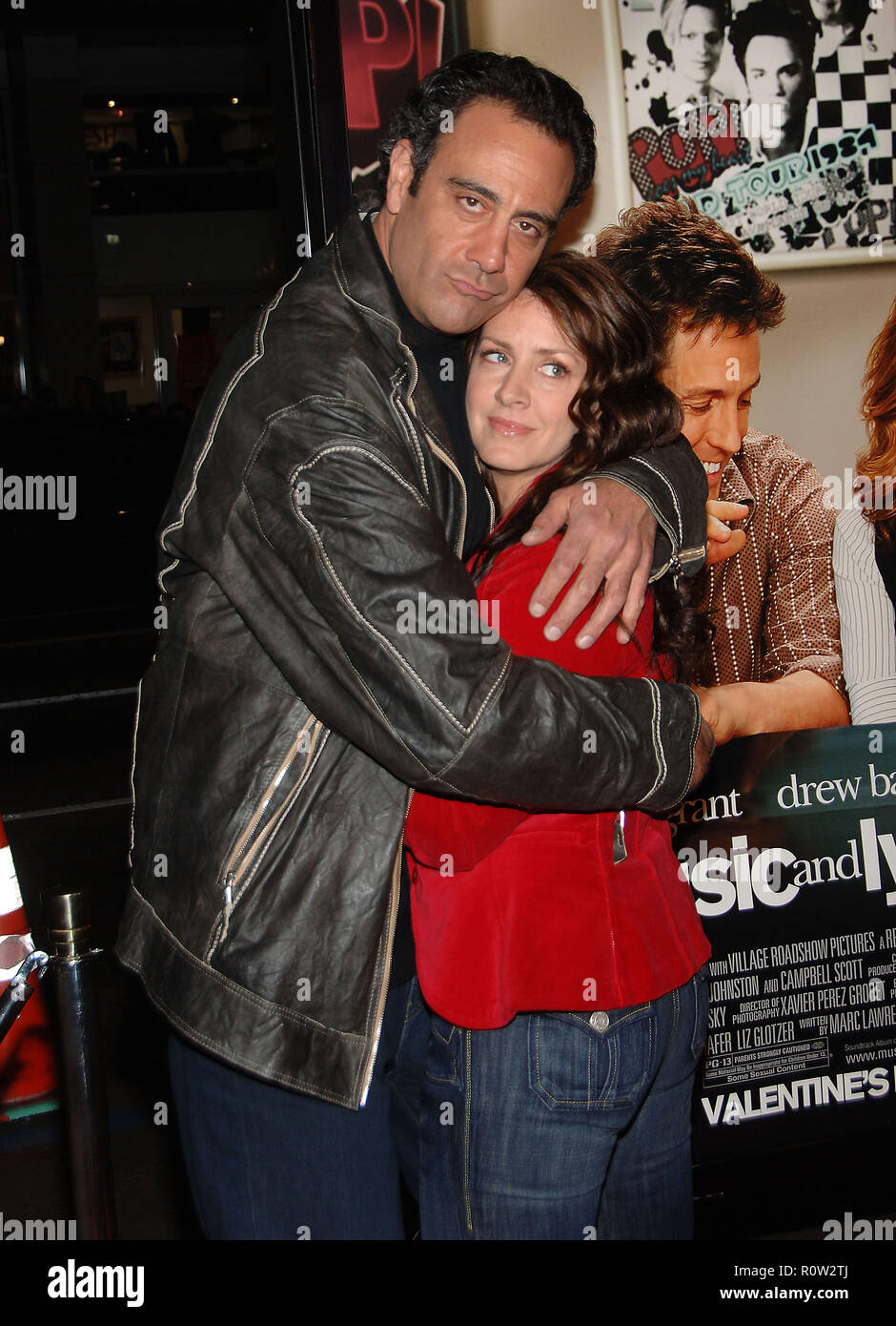 Brad Garrett and Joely Fisher arriving at the Music And Lyrics Premiere at the Chinese Theatre in Los Angeles.  3/4 hug fun          -            Garr Stock Photo