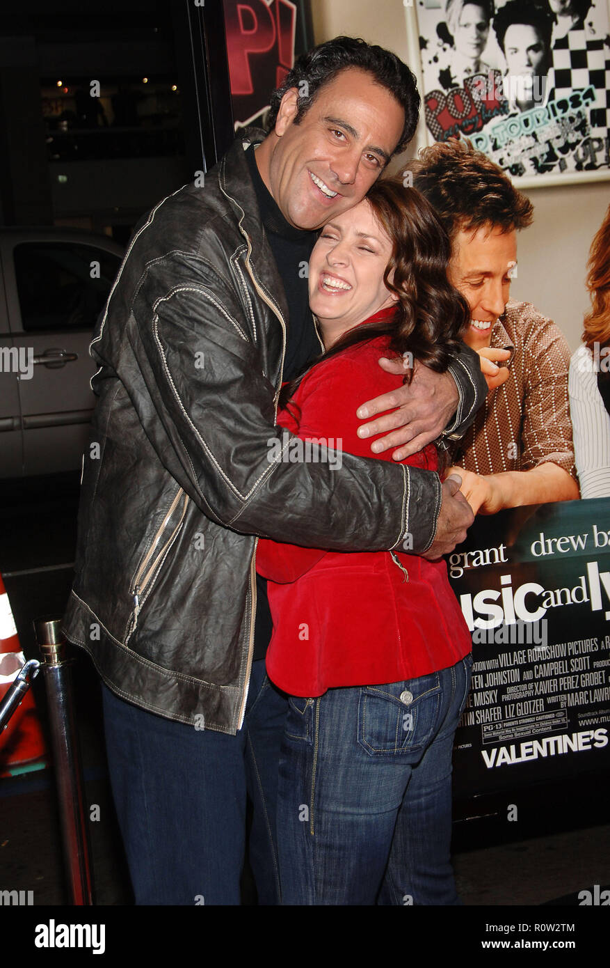 Brad Garrett and Joely Fisher arriving at the Music And Lyrics Premiere at the Chinese Theatre in Los Angeles.  3/4 hug fun smile          -           Stock Photo