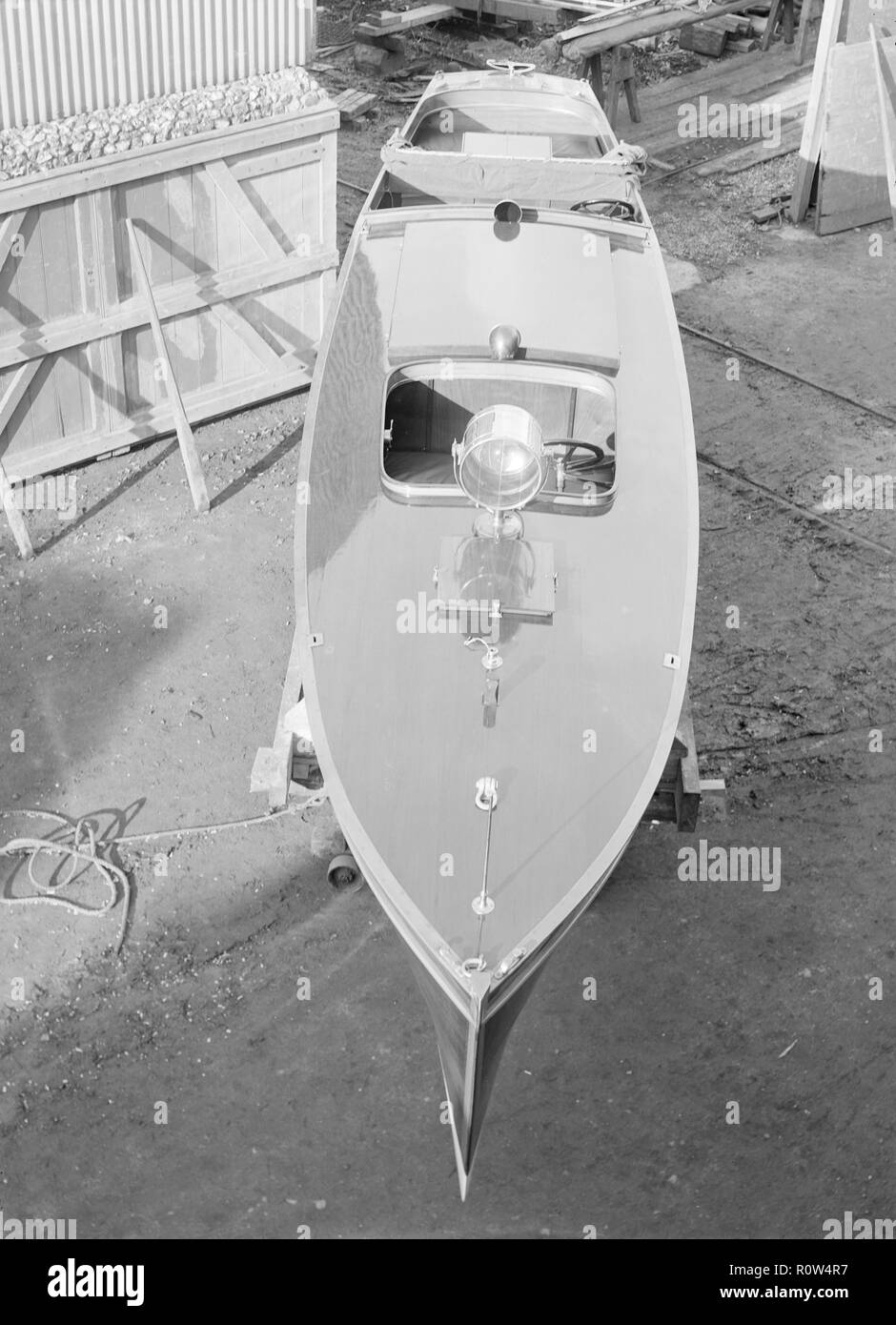 Motor launch in boatyard, 1913. Creator: Kirk & Sons of Cowes. Stock Photo