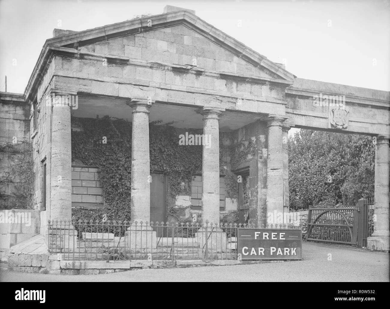 Neoclassical facade with 'Free Car Park' sign, c1935. Creator: Kirk & Sons of Cowes. Stock Photo