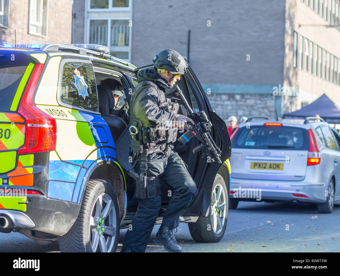 Armed Firearms Police officers demonstrating a vehicle stop and arrest of a suspected armed criminal/terrorist at a police open day Stock Photo