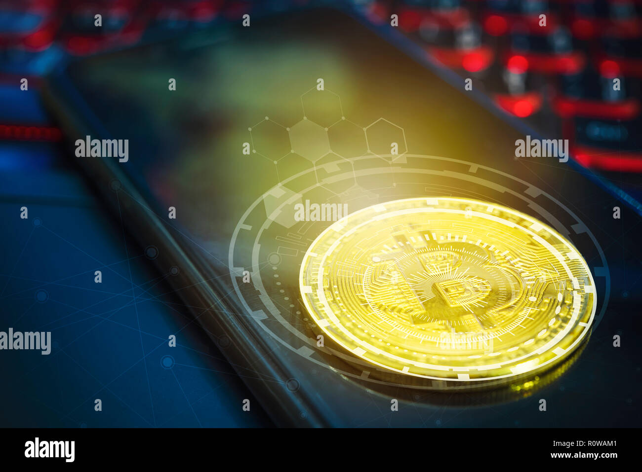 Bitcoin concept. Golden bitcoin on empty mobile screen on laptop with technology icons and free space background. Picture for add text message. Backdr Stock Photo