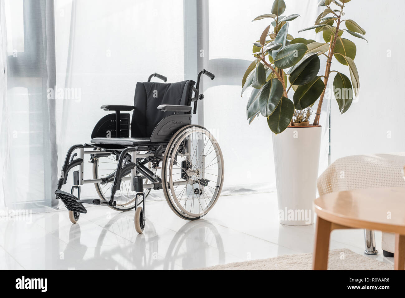 empty wheelchair in nursing home Stock Photo