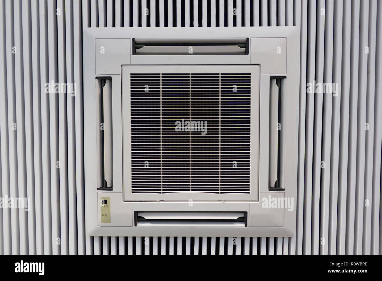 White Air Conditioner Attached To White Wood Planks Ceiling