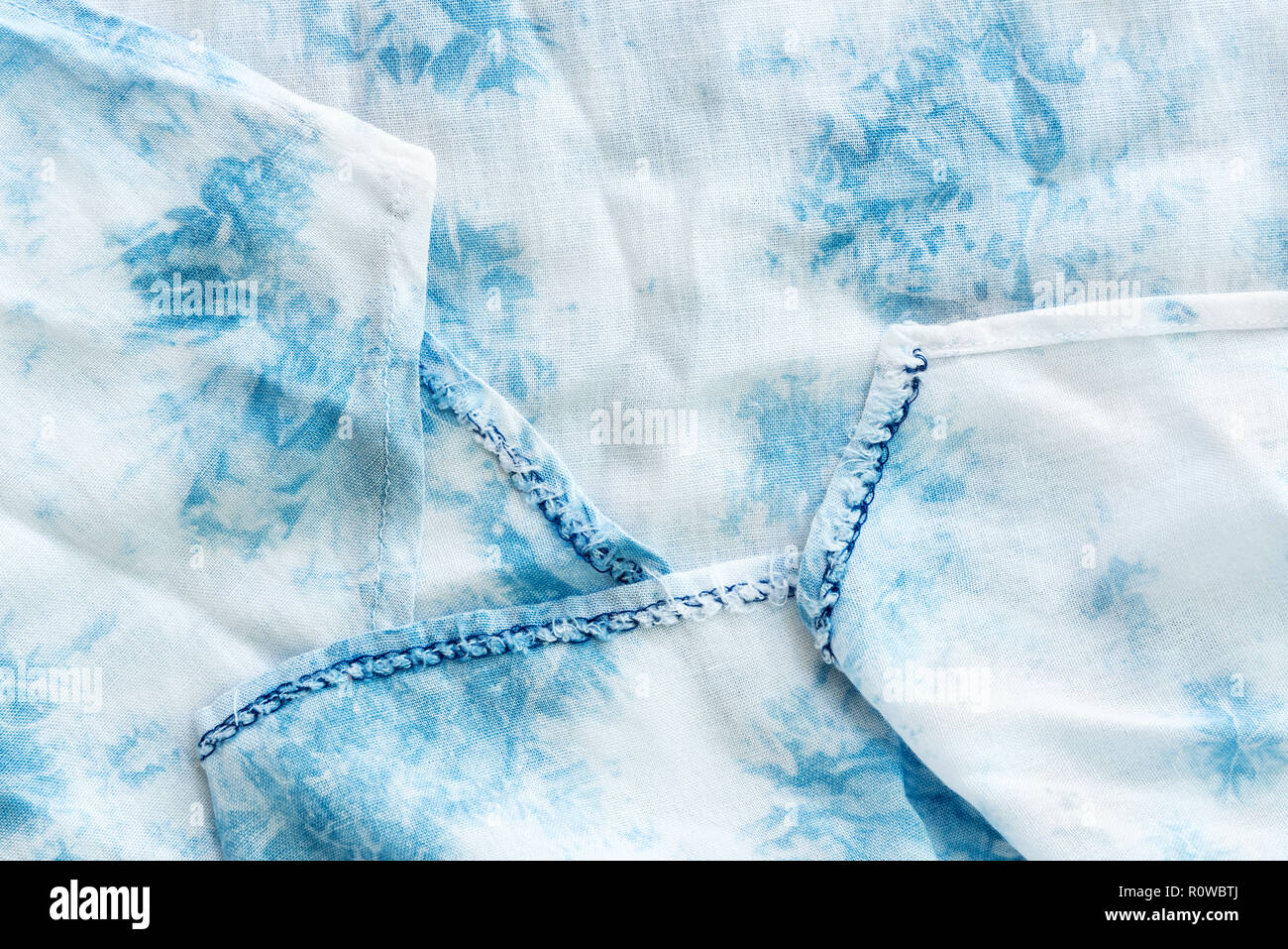 Texture of white and blue soft fabric on table. Abstract background. Picture for add text message. Backdrop for design art work. Stock Photo