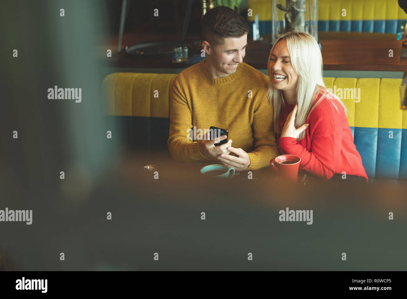 Couple having fun in cafe Stock Photo