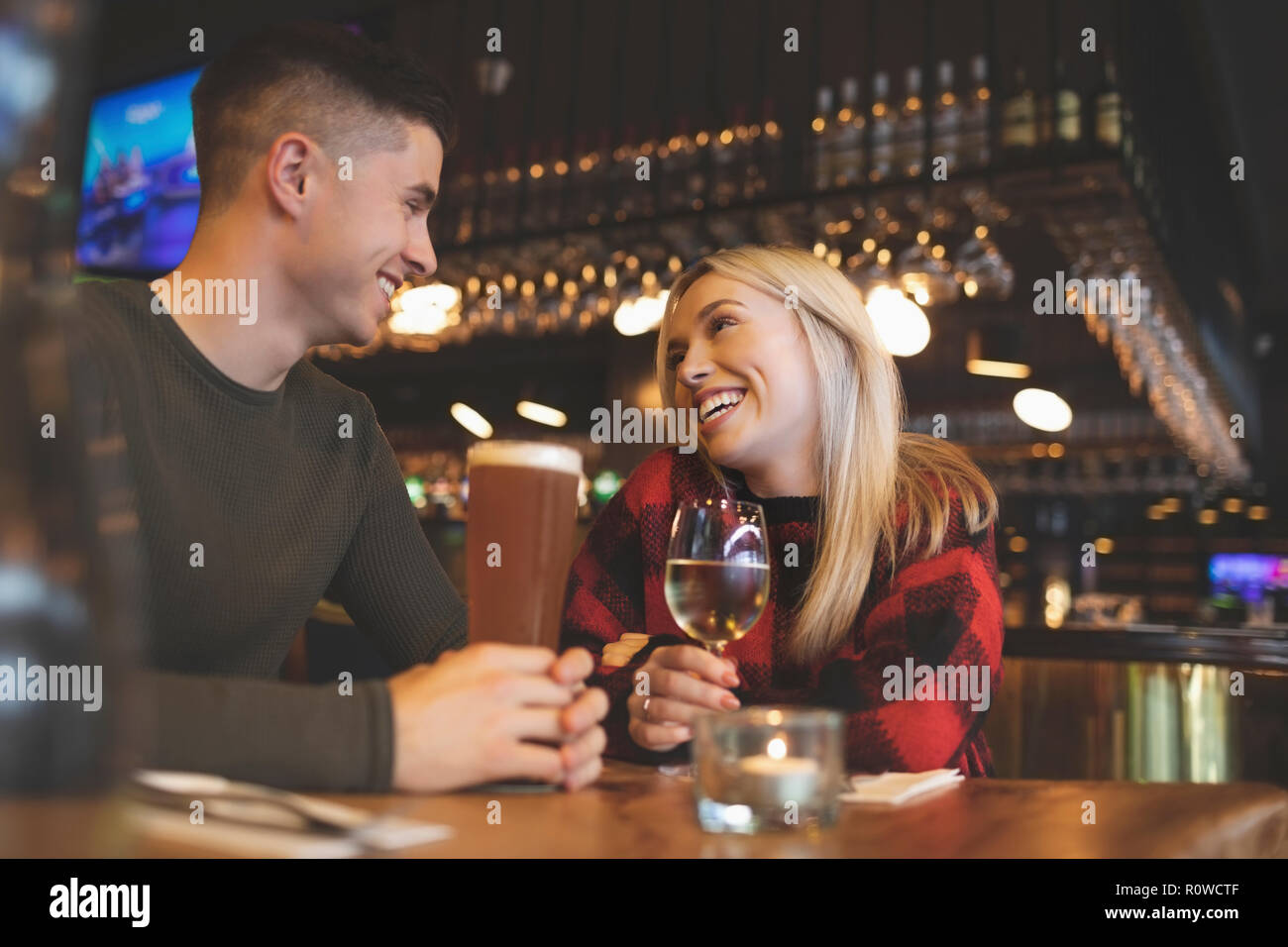 Couple having drinks in restaurant Stock Photo