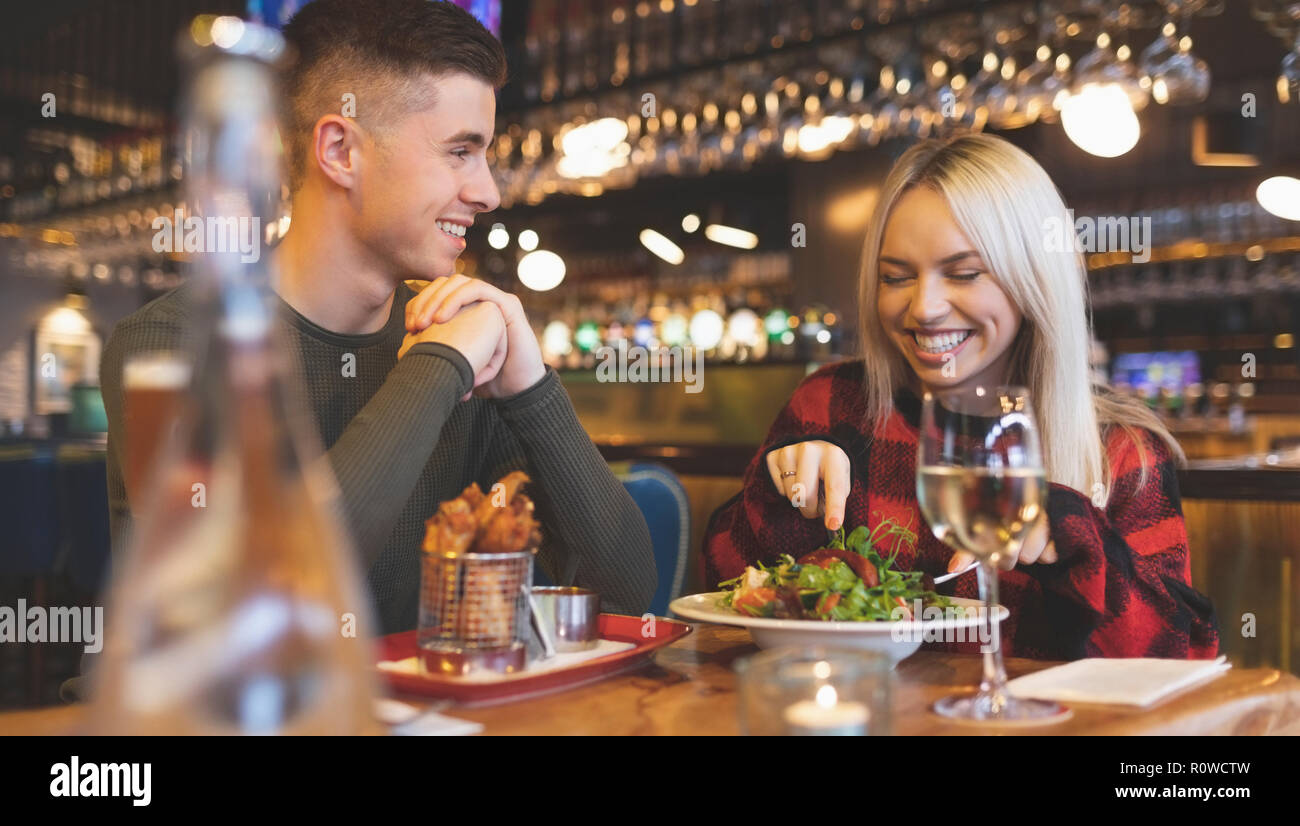 Couple having food in restaurant Stock Photo