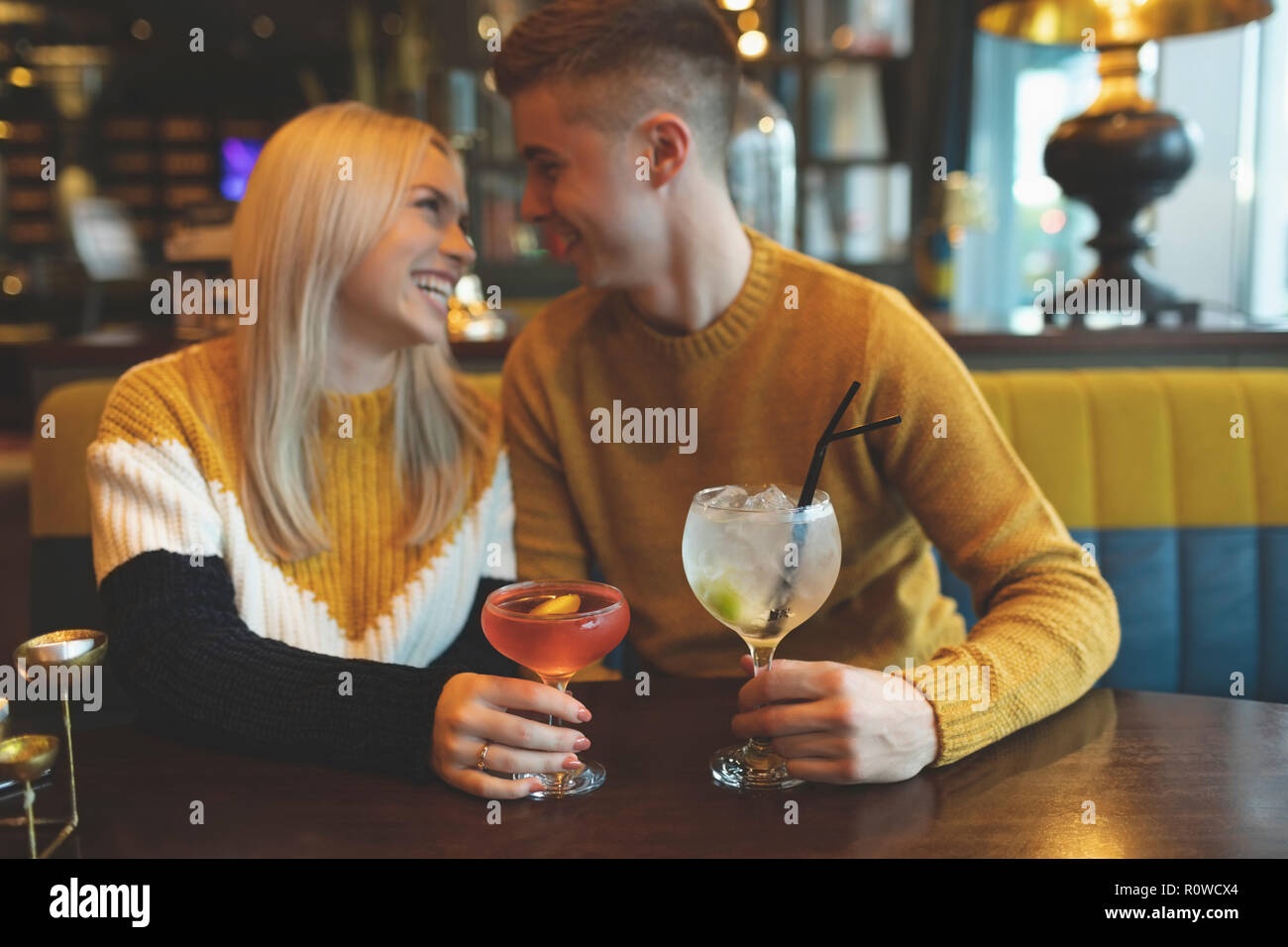Couple having drinks in restaurant Stock Photo