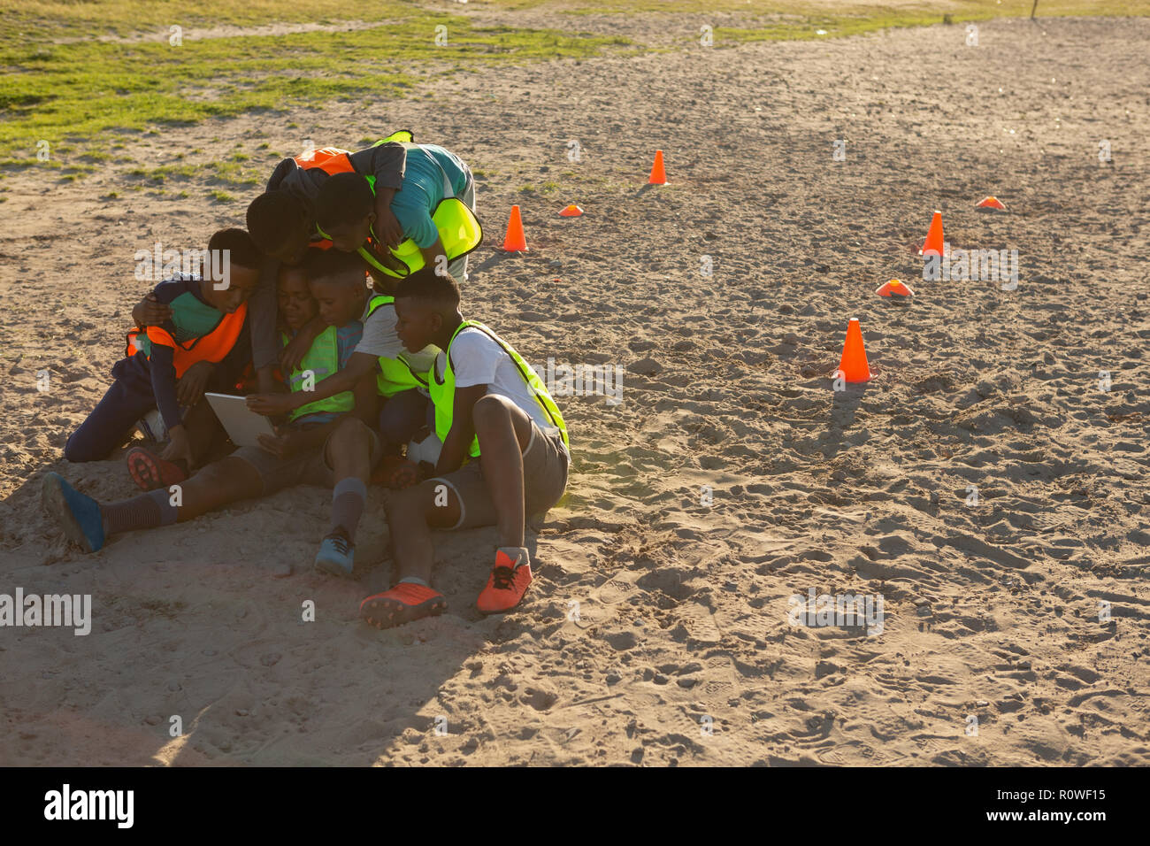 Kids using digital tablet in the ground Stock Photo
