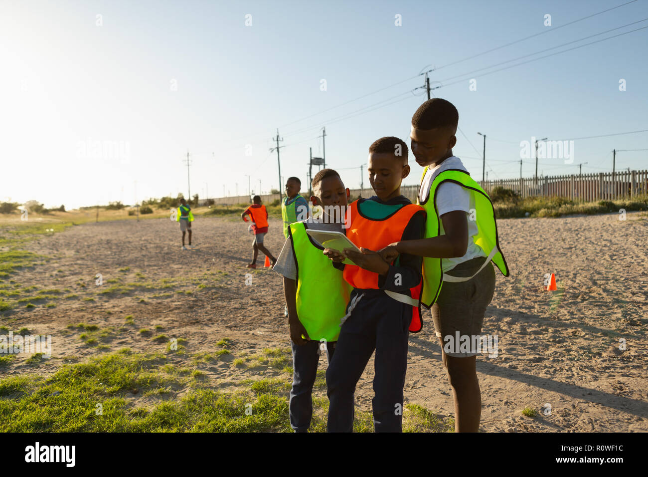 Kids using digital tablet in the ground Stock Photo