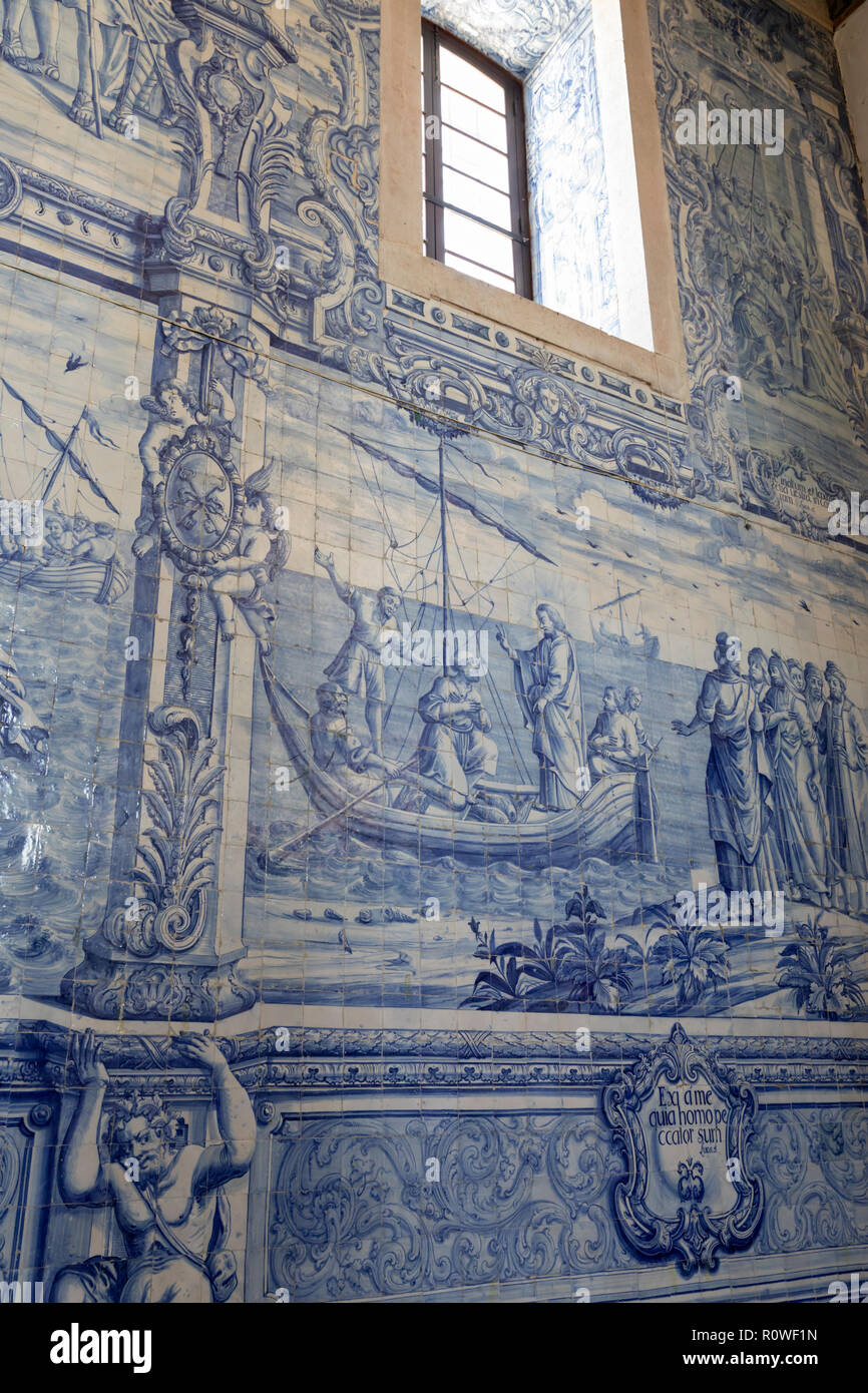Azulejo tiles depicting scene from the bible on interior wall of the Igreja de Sao Pedro de Palmela Stock Photo
