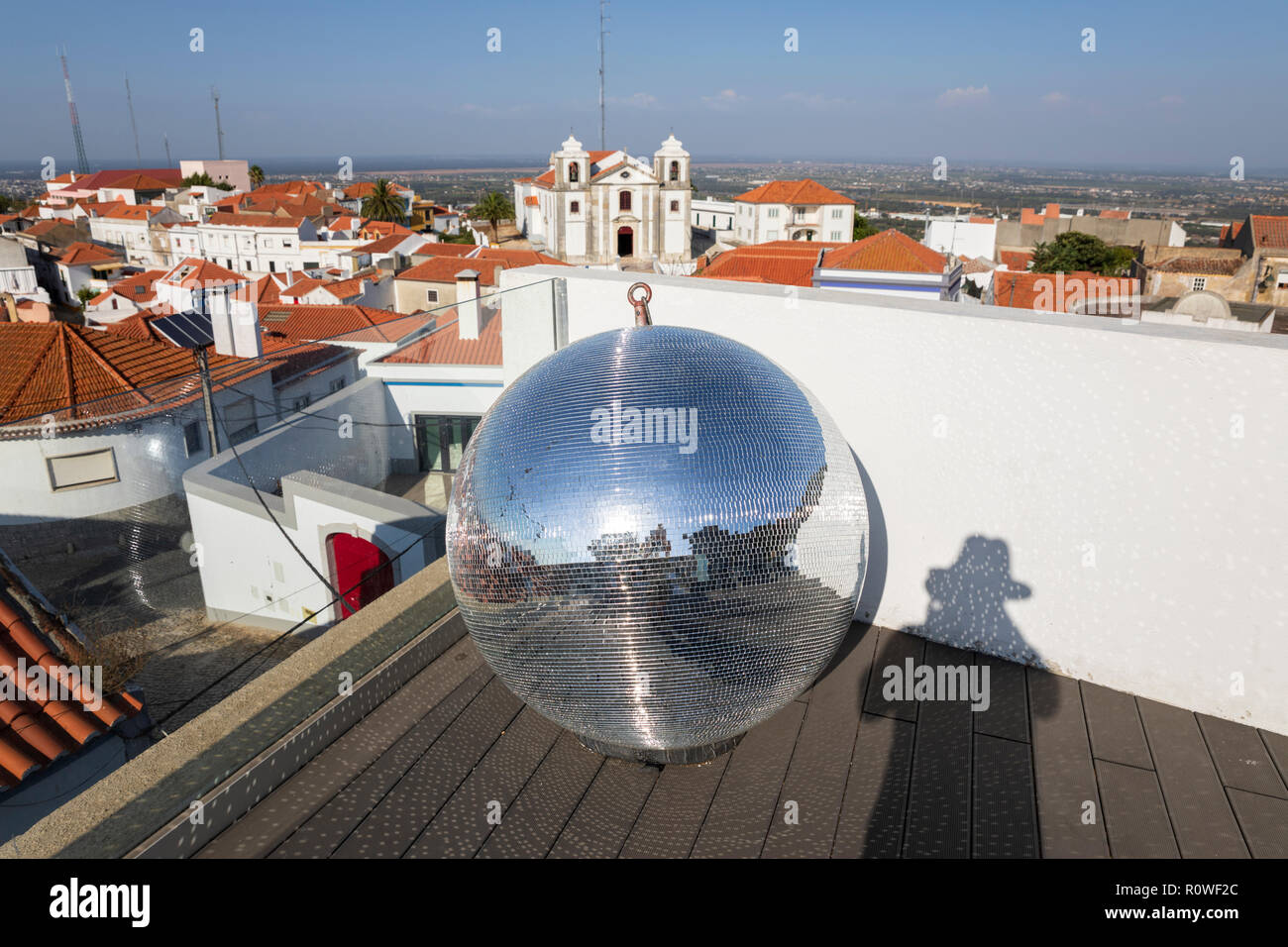 Mirror ball and view over town of Palmela with the Igreja de Sao Pedro de Palmela church, Palmela, Setubal district, Lisbon region, Portugal, Europe Stock Photo