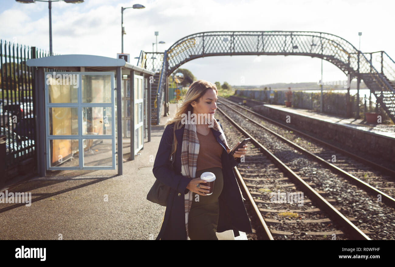 Pregnant woman using mobile phone Stock Photo