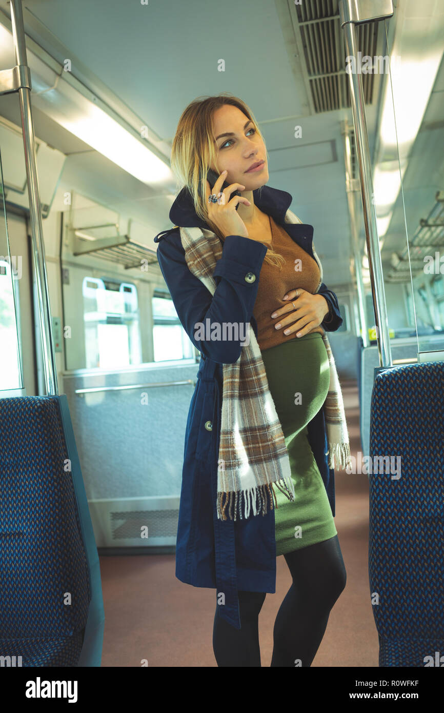 Pregnant woman standing on train hi-res stock photography and images ...